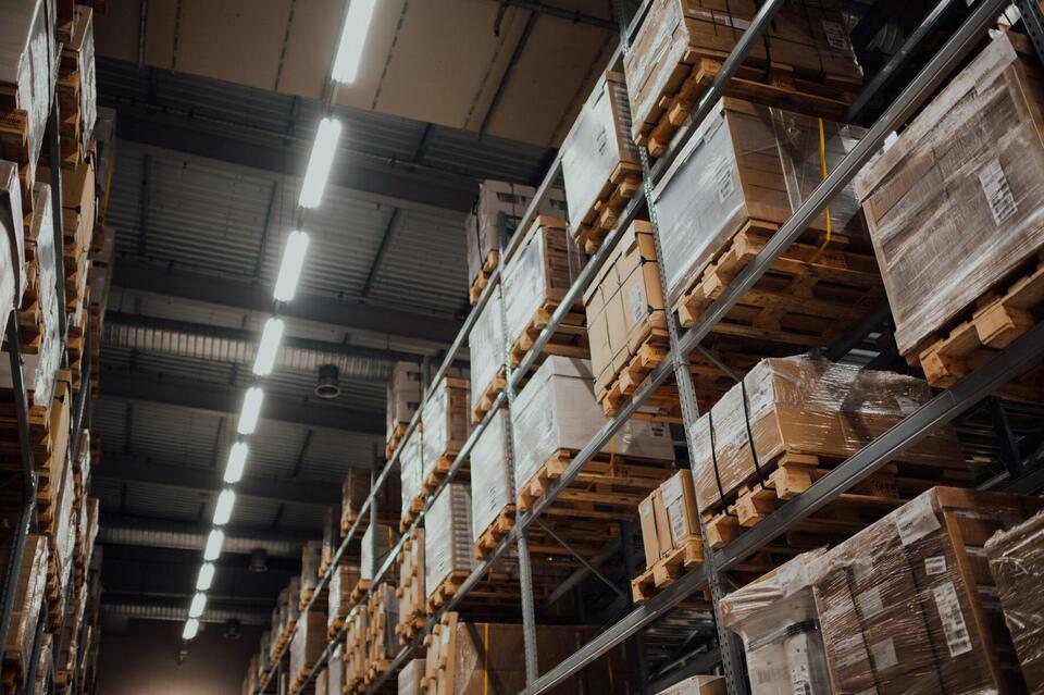 Warehouse aisle stacked with palletized boxed freight